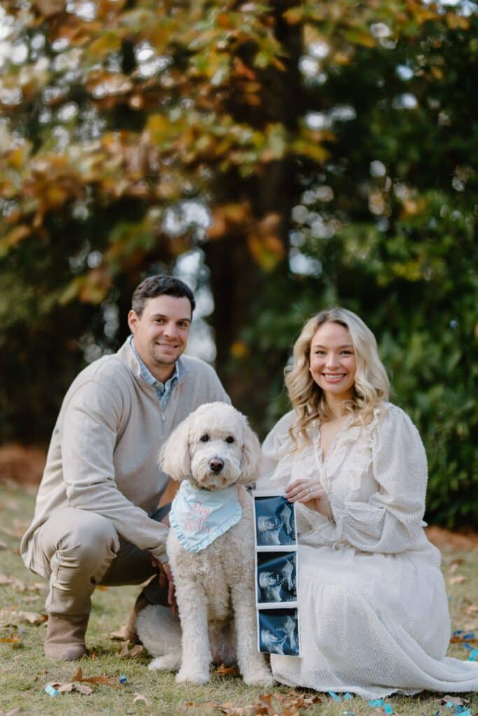 married couple with goldendoodle gender reveal